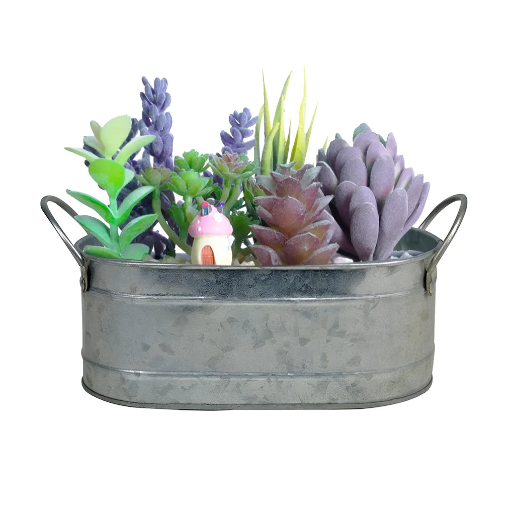 Galvanised iron succulent flowerpot with rustic finish on a wooden desk.