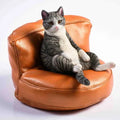 Sleeping cat figurine on miniature sofa car dashboard ornament
