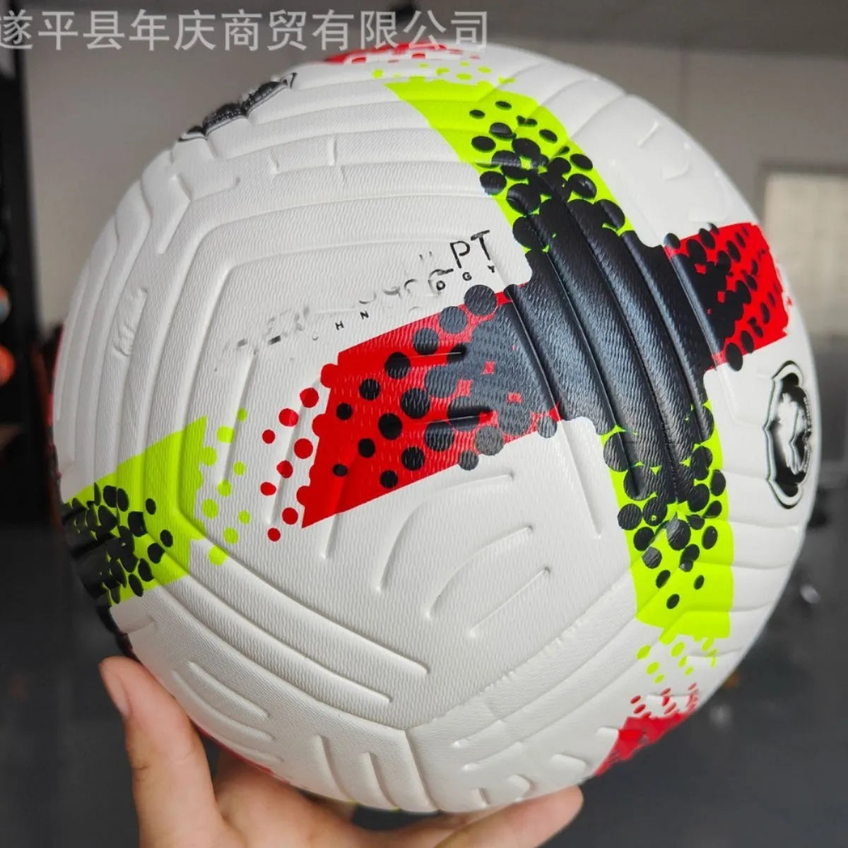 Fluorescent green size 5 PU football with seamless thermal adhesive patch construction.