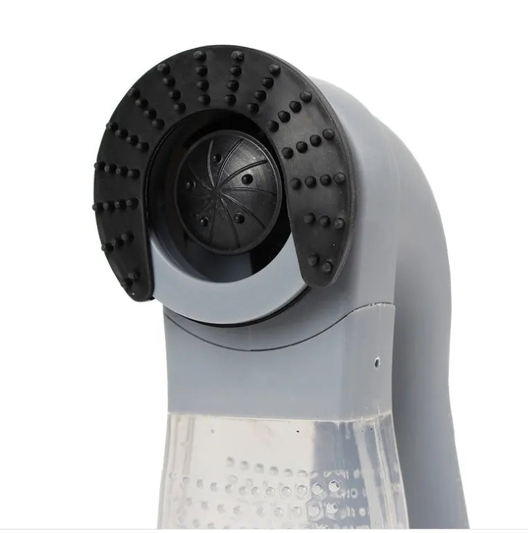 Grey portable electric pet hair remover brush with soft rubber head for grooming dogs and cats.