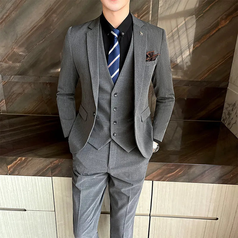 Men's slim fit business suit in black cotton blend fabric with structured tailoring