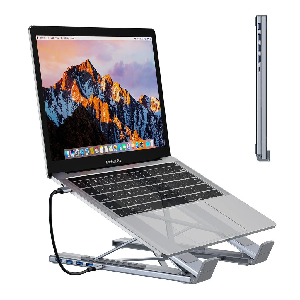 Silver aluminum alloy folding laptop stand with 8-in-1 HDMI docking station ports visible