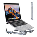 Silver aluminum alloy folding laptop stand with 8-in-1 HDMI docking station ports visible