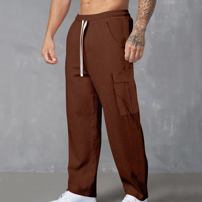 Men's straight leg corduroy cargo trousers in army green with a drawstring waist and loose wide-leg fit.