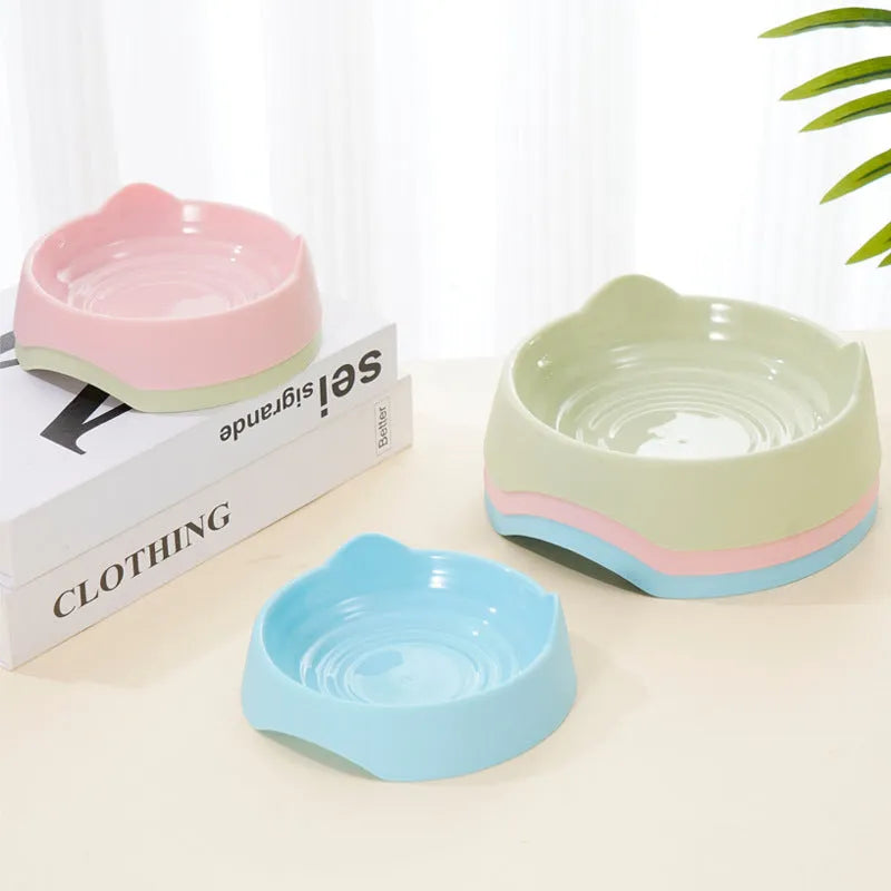 Blue ceramic dog slow feeder bowl with raised internal maze pattern for portion control