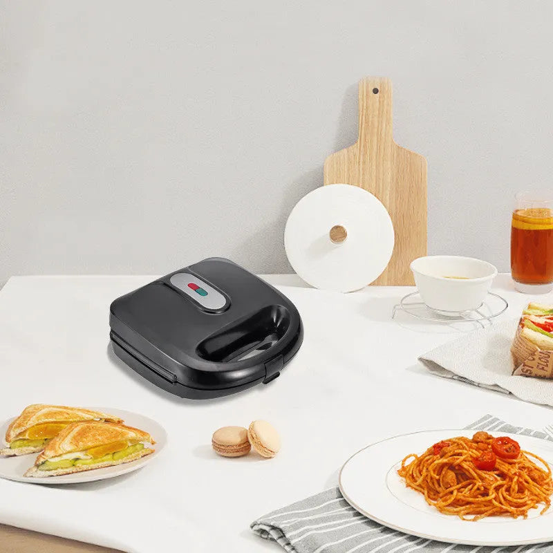 Black double-sided electric sandwich maker with brushed stainless steel lid and non-stick plates
