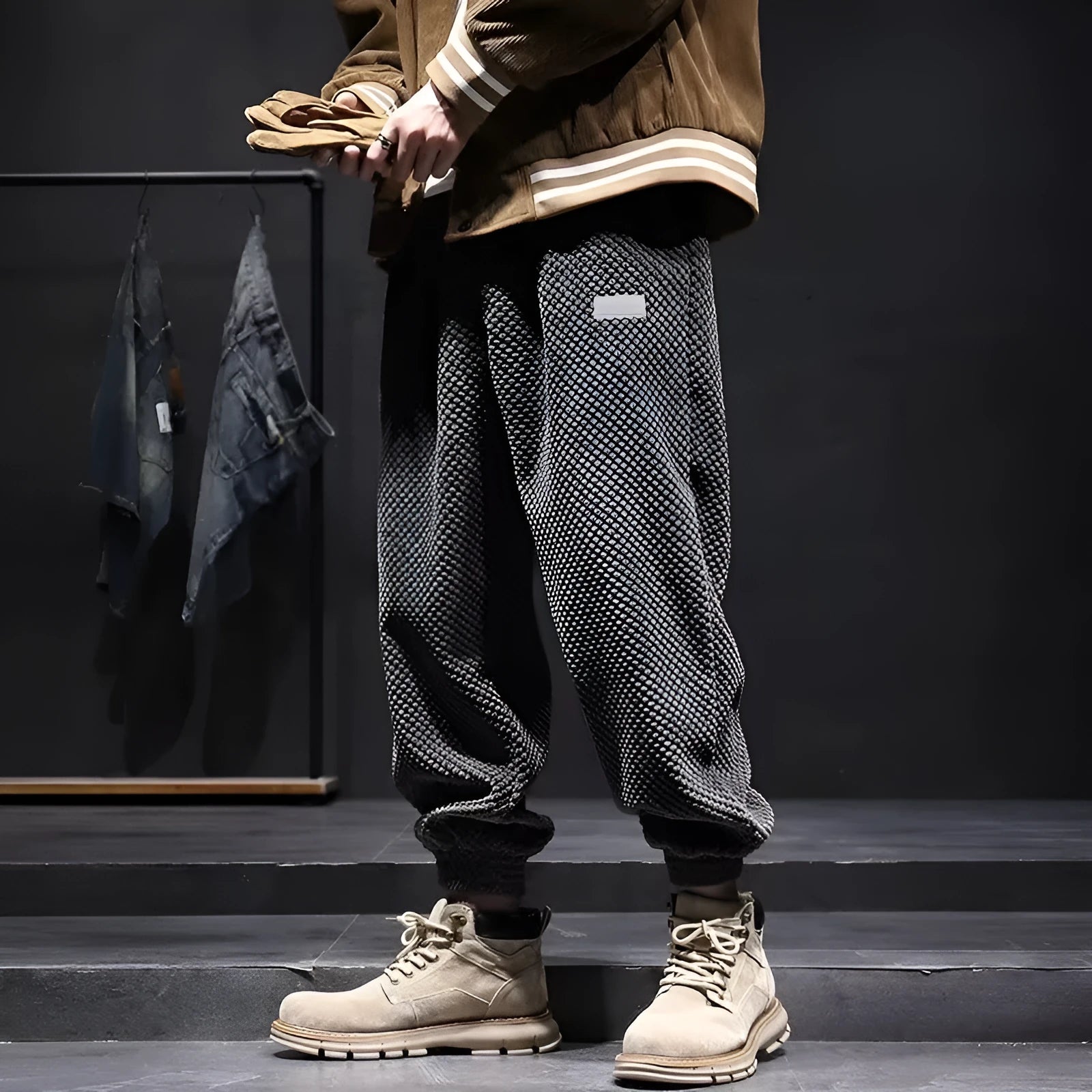 Men's grey straight-leg sweatpants with ankle ties laid flat.