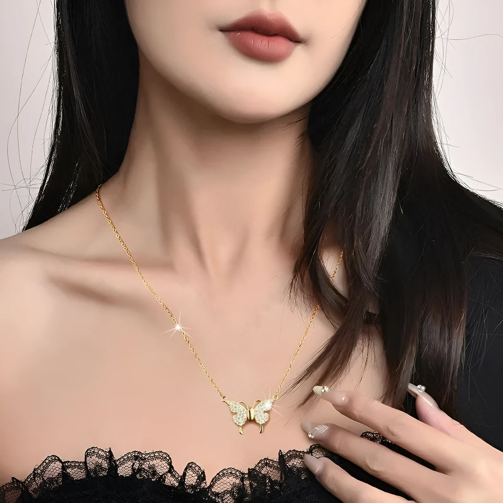 Gold titanium steel clavicle necklace with magnetic snap and butterfly pendant on twisted chain.