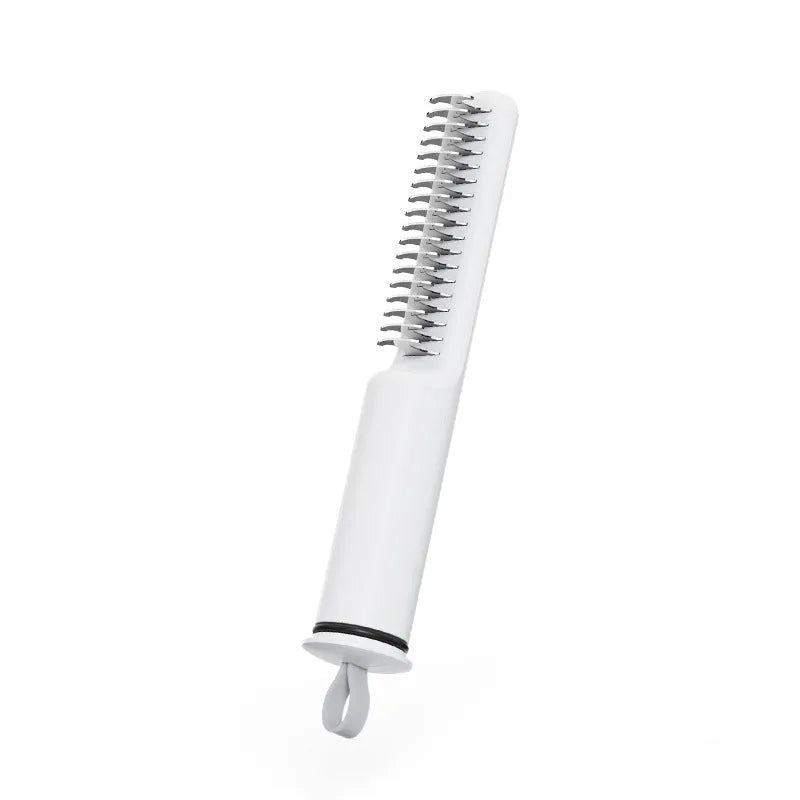 Stainless steel pet dematting comb with rake teeth and a handle for grooming dogs.