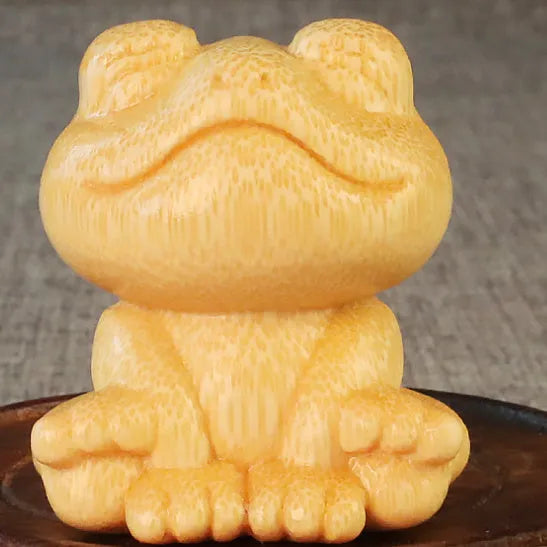 Solid bamboo smiling frog carving ornament measuring 5cm height with cartoon design