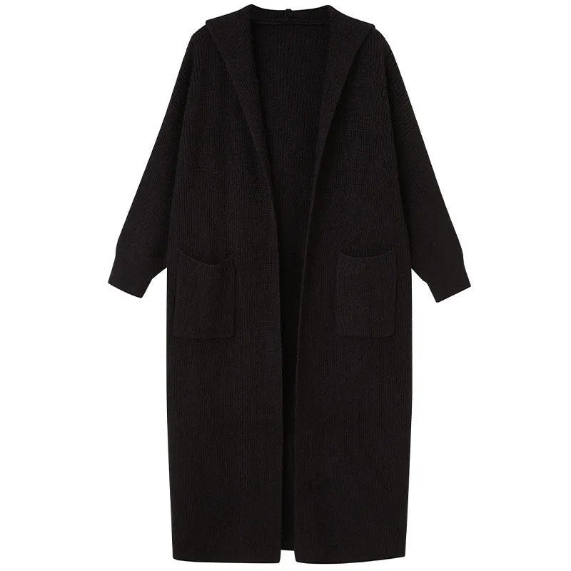 Long grey knitted cardigan coat with a hood, shown in a loose fit.