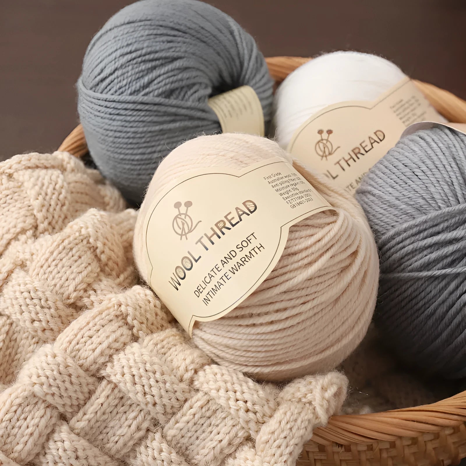Roll of wool knitting thread for hand-knitted scarves and sweaters in various colour options