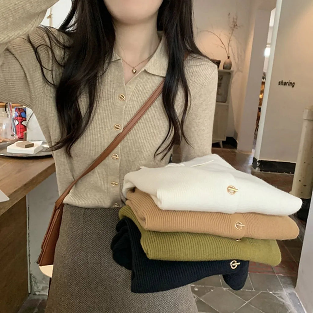 A loose-fitting, long-sleeved beige knitted cardigan for women, made from viscose fibre.