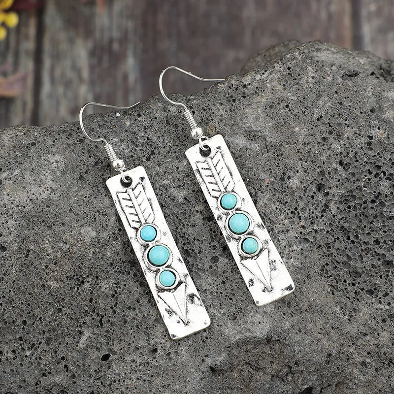 Women's silver geometric retro earrings with inlaid turquoise detailing on long strip design