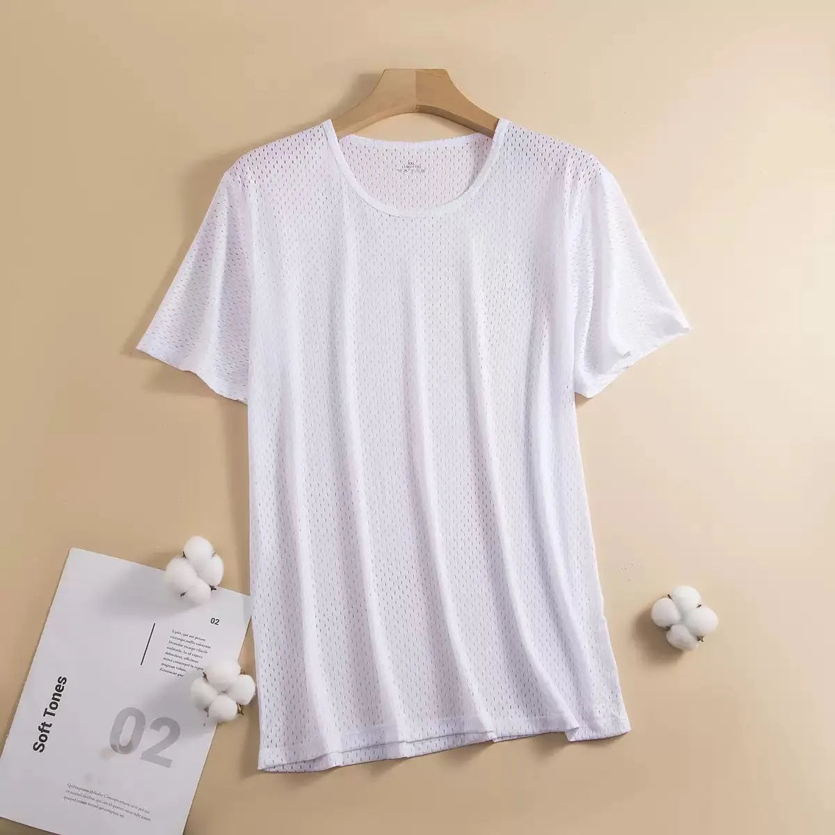 Man wearing a solid colour ice silk short sleeve t-shirt with a loose crew neck fit