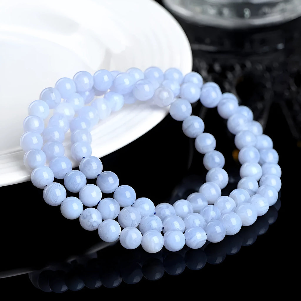 Blue striped agate bracelet with scattered beads showing multi-circle pattern