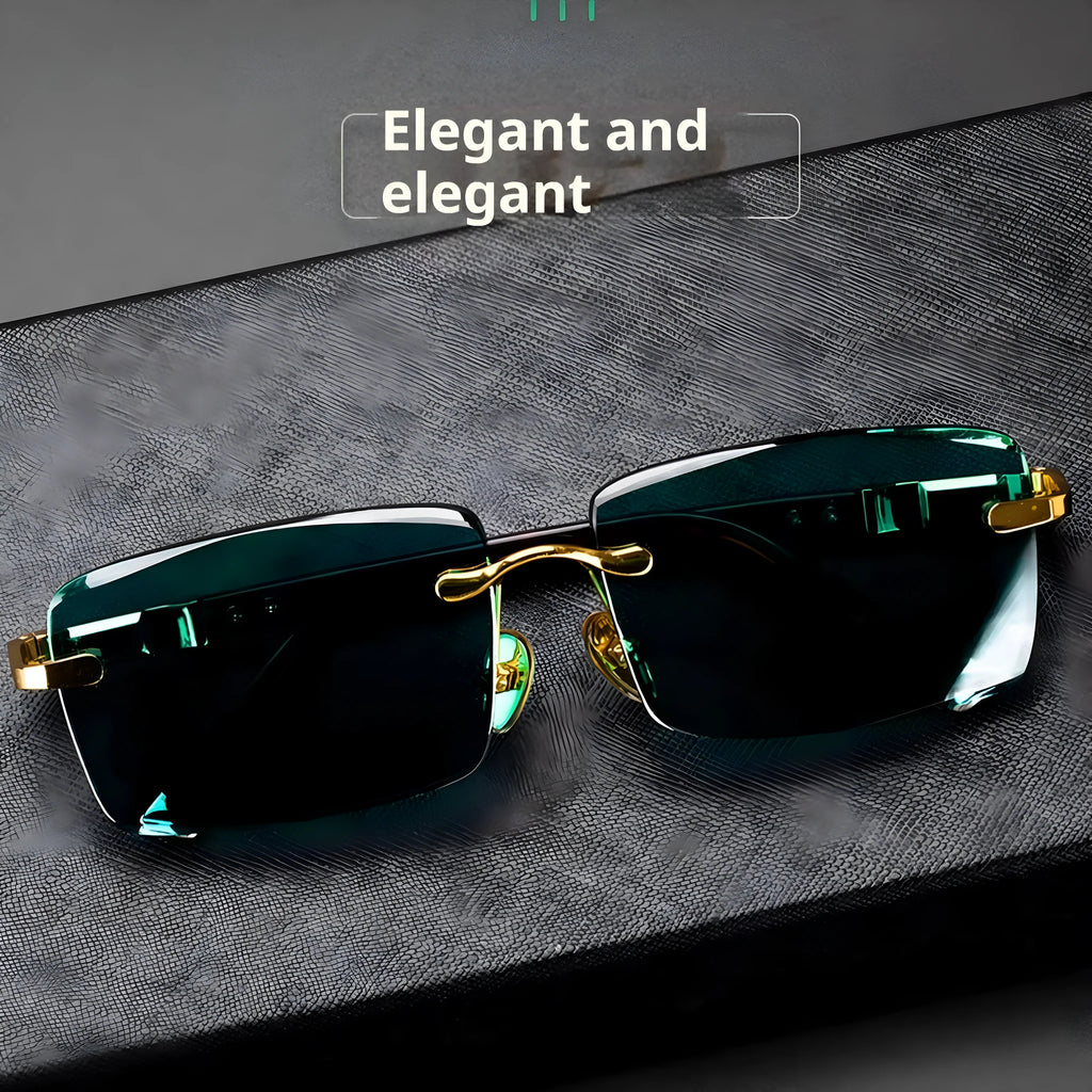 Frameless sunglasses with dark green tinted lenses lying on a hard protective case with a microfiber cloth.