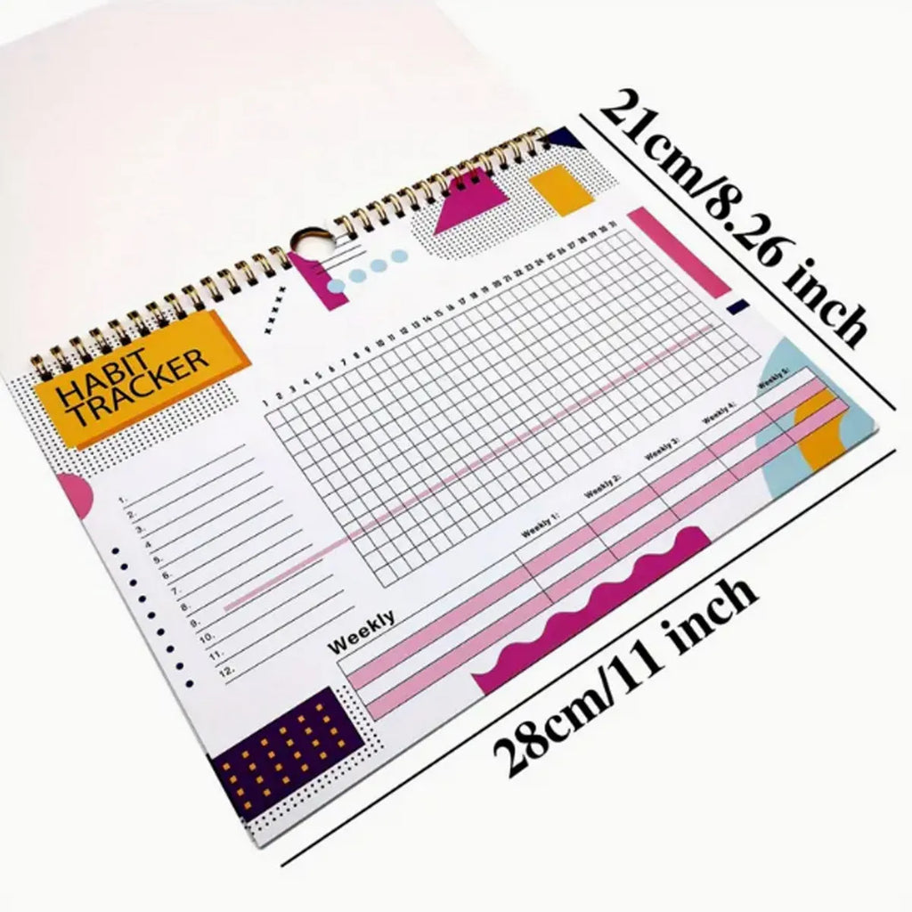 Habit tracking journal open showing internal pages with 21x28cm dimensions and coloured cover