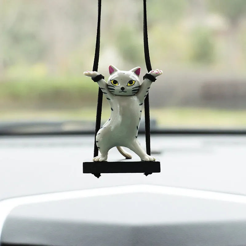 Cartoon-style resin cat pendant on a 25cm rope for hanging from a car rear-view mirror.