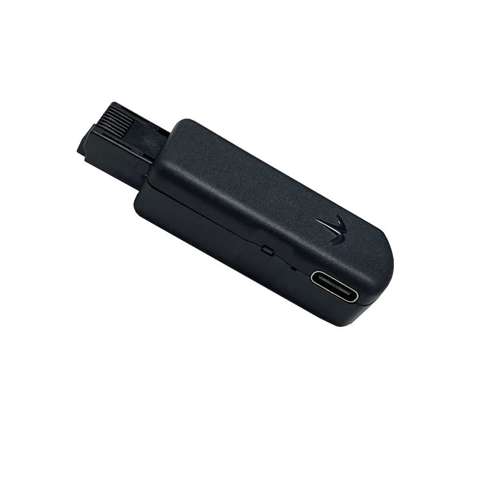 Black JB Tool USB adapter for PlayStation 4 with Ethernet port, shown with data cable.