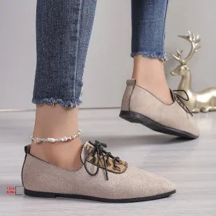 Beige leopard print women's plus size pointed toe pumps with a faux PU upper and rubber sole.