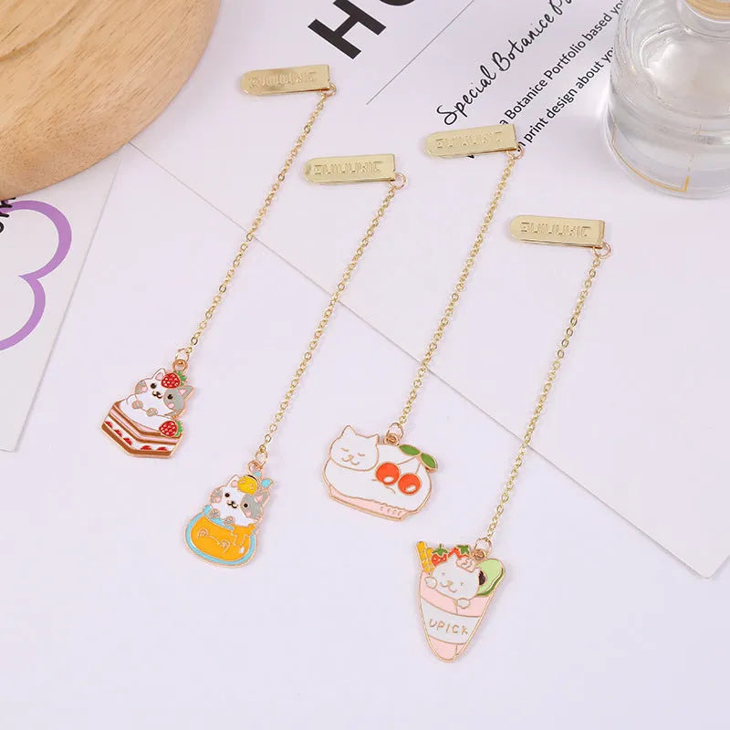 Jane Lime metal pendant cat cartoon bookmark in four colourful designs on a white background.