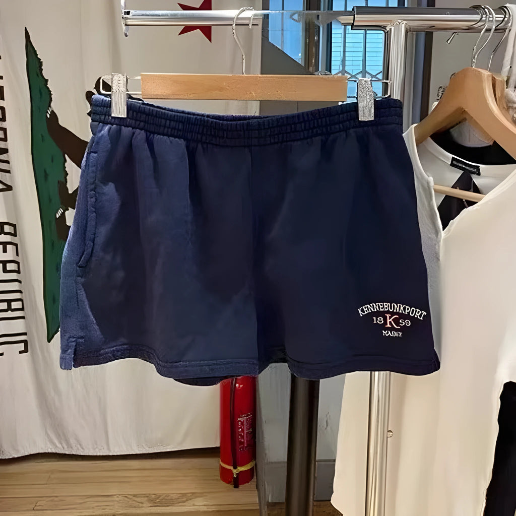 Women's dark blue cotton sports shorts with white flag embroidery, mid-thigh length athletic wear