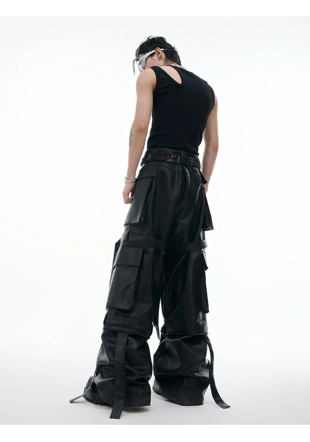 Black loose-fit retro trousers with quilted pattern and multiple stitched pockets.