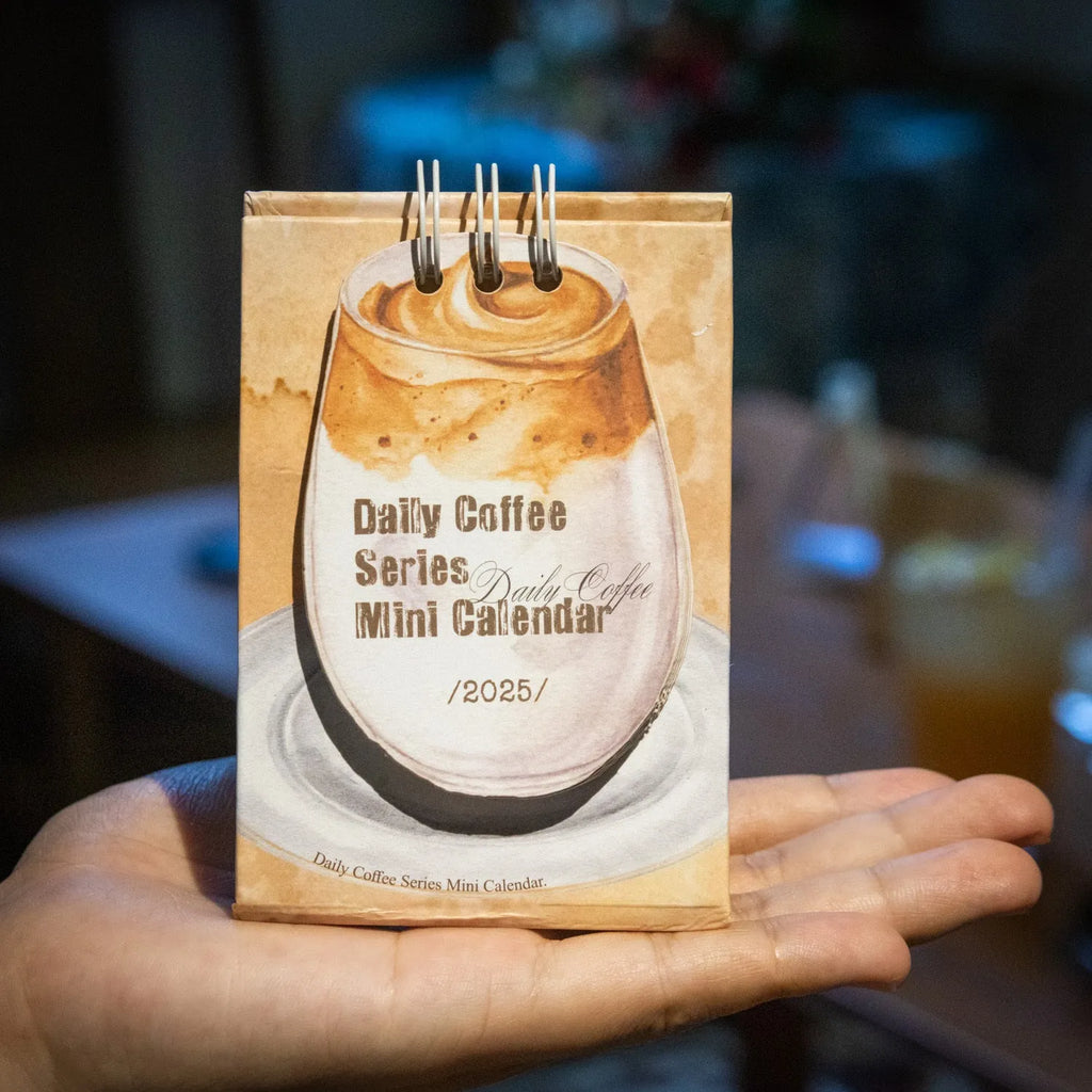 A5 size 2025 mini desk calendar open to a page showing a date and motivational quote.