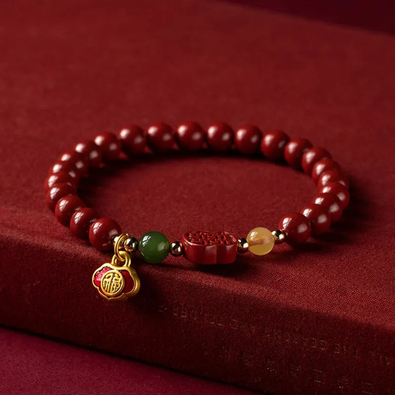 Emperor sandstone bracelet with cinnabar fu character in New Chinese style, shown in 6mm and 8mm bead sizes.