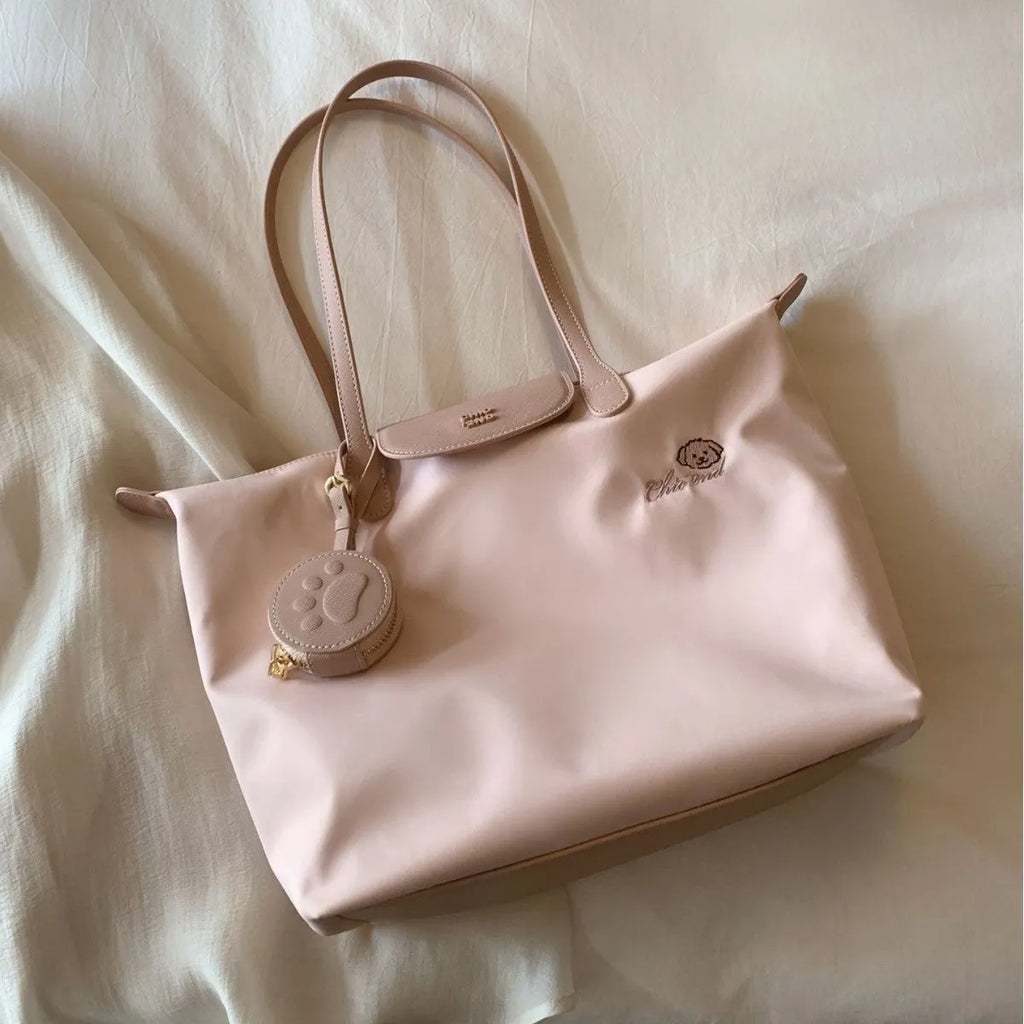 Oxford cloth tote bag in pink with sandwich pocket design and shoulder strap