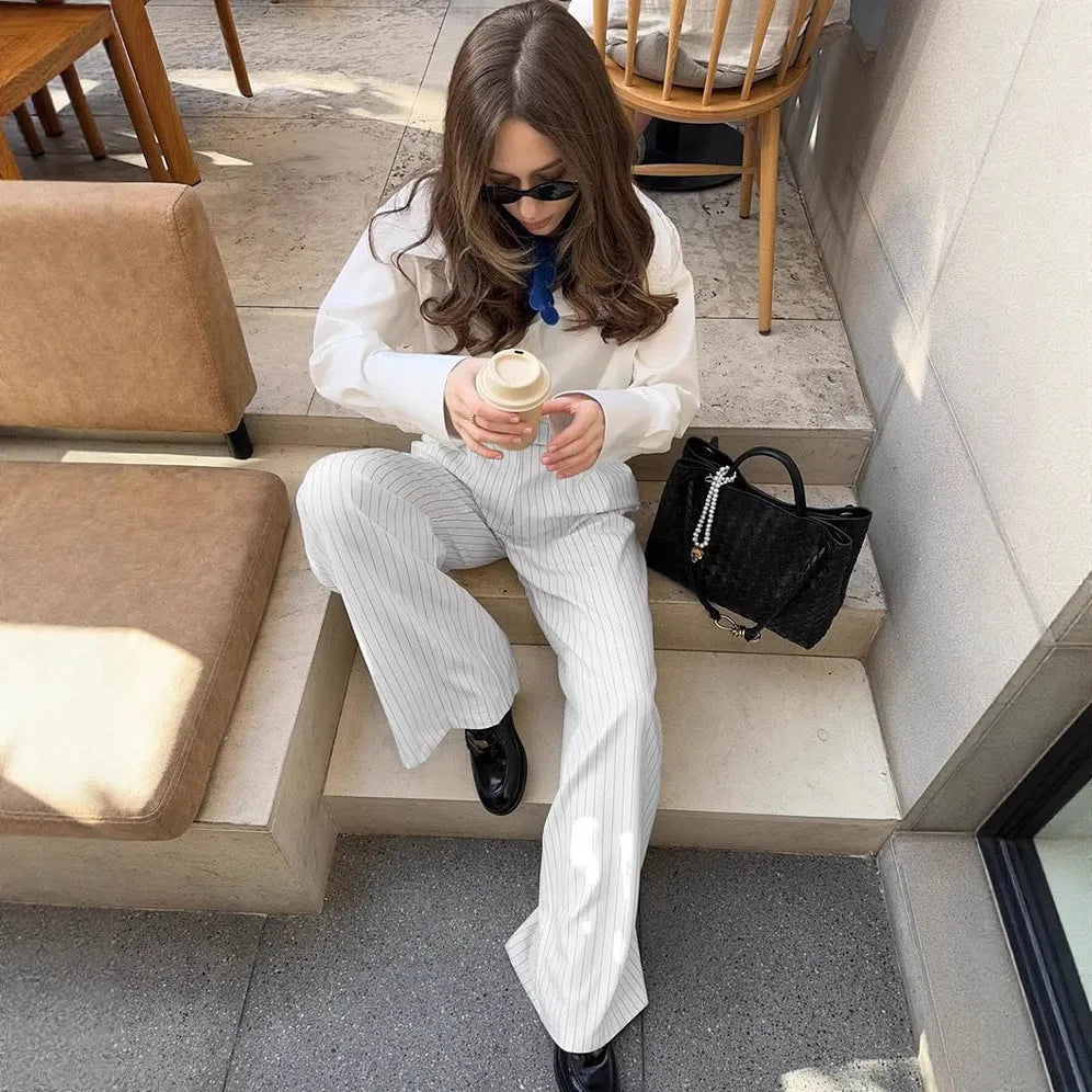 White striped wide-leg trousers with front zip fastening and loose casual cut for commuting