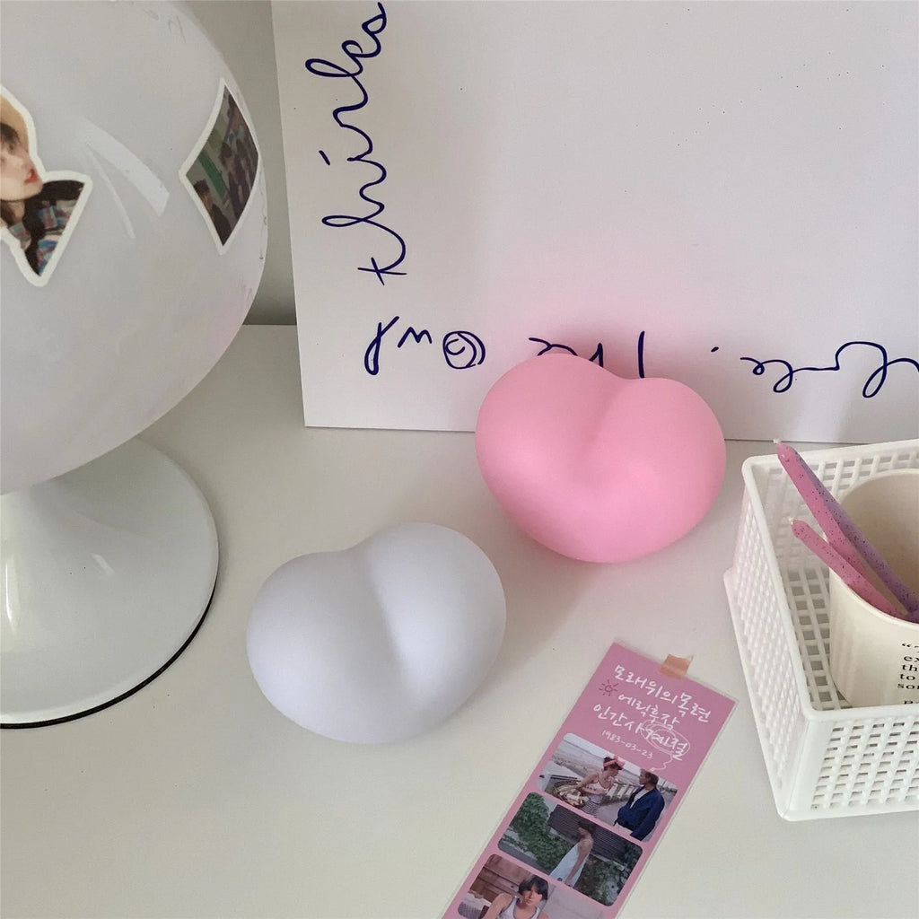 Pink and white vinyl atmosphere lamp creating a warm glow for decorative lighting.