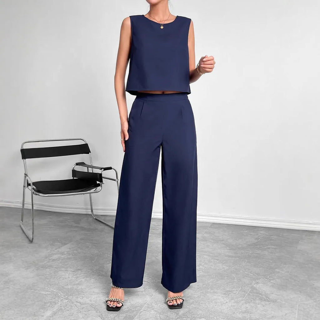 Red women's sleeveless top and wide-leg trousers two-piece set laid flat