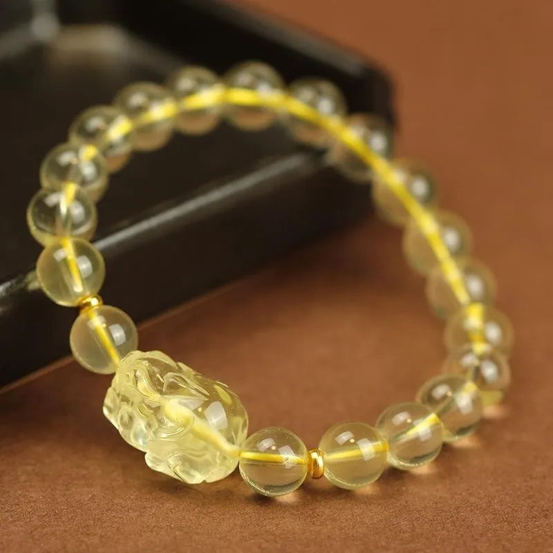 Yellow Pi Xiu bracelet with artificial crystal on leather strap in Chinese folk style design