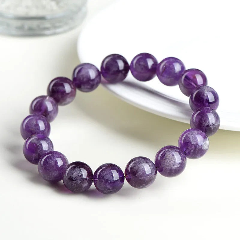 Natural Feather Amethyst bracelet with scattered beads in Snow Mountain purple colour on white background