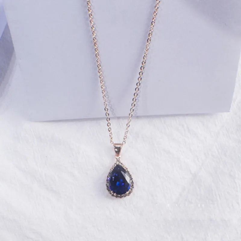 Women's drop shape necklace with rhinestone inlay and geometric design in pink colour option
