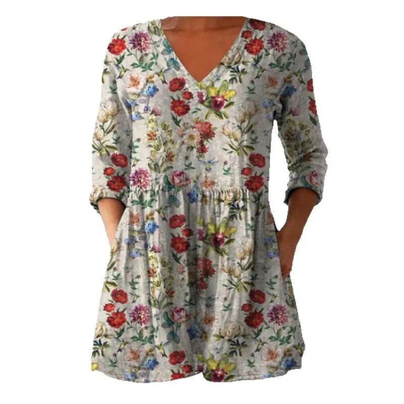 Women's printed loose dress with 3/4 sleeves and a wave skirt, shown in a variety of pattern styles.