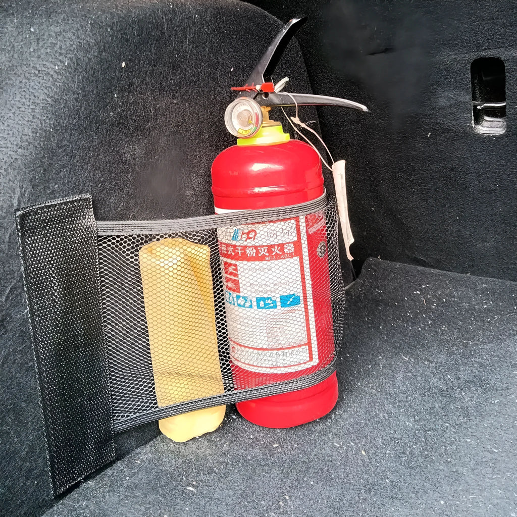 Elasticated grey polyester storage net stretched across a car boot, holding assorted items.