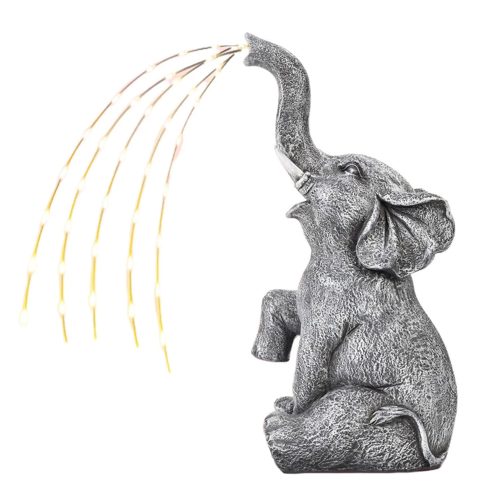 Resin elephant garden sculpture with integrated light strip for outdoor patio or lawn decoration.
