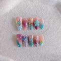 Handmade nail art sculptures with colourful embossed flower and butterfly designs