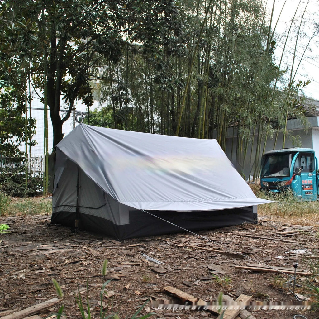 Brown A-line trekking tent pitched using hiking poles with dimensions 210x150x110cm