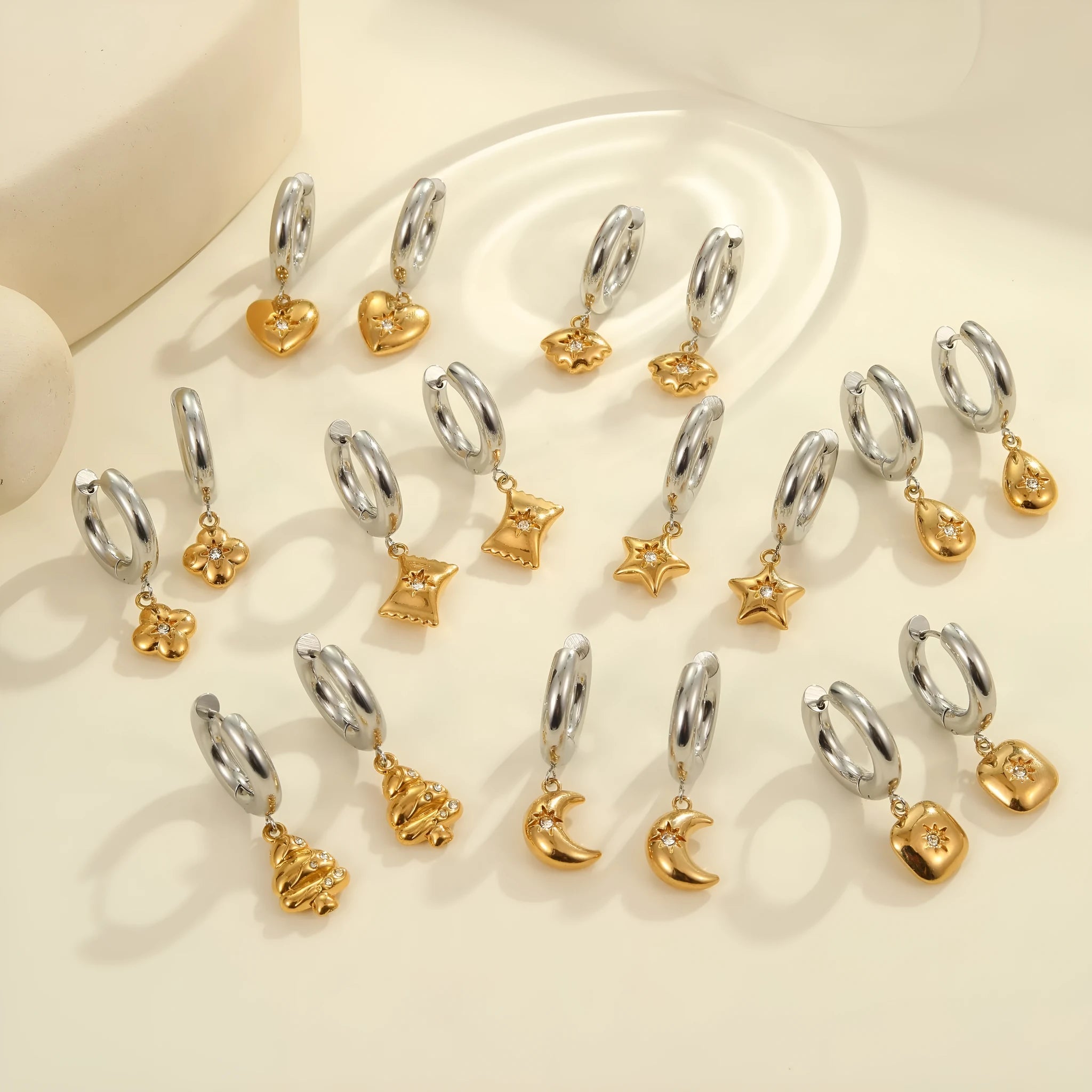 Women's stainless steel drop earrings with 18K gold electroplating in Christmas tree and heart shapes.