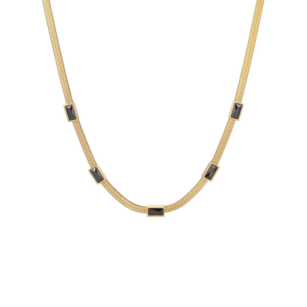 Gold geometric square zircon pendant on a stainless steel flat snake chain necklace.