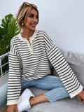 Black striped women's casual top with drop-shoulder sleeves and button detailing