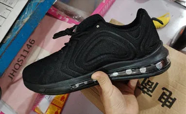 Men's black casual air cushion sneakers with thick sole and lace-up front.