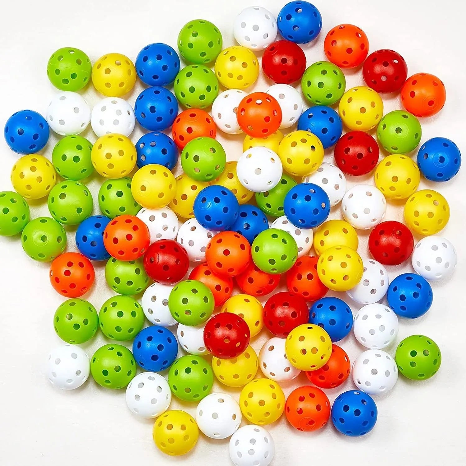 Six different coloured golf practice balls showing red, orange, blue, green, white and yellow variations with net bag packaging