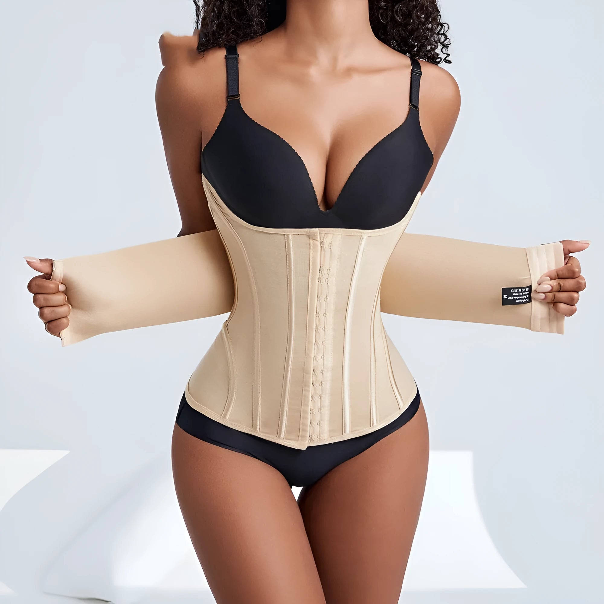 Nylon belly band waist trainer in black, showing adjustable belt tie fastener.