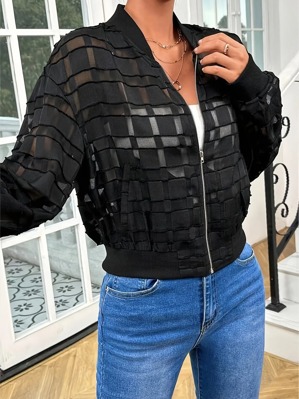 Black semi-transparent women's jacket with geometric pattern and front zipper