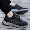 Adult unisex breathable mesh slip-on shoes in black, purple, and dark grey with an elastic band.